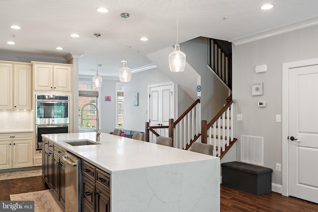 138 Merrimack Way, Arnold, MD 21012 - kitchen featuring cream cabinets, stainless steel appliances, crown molding, a sink, and dark wood-type flooring