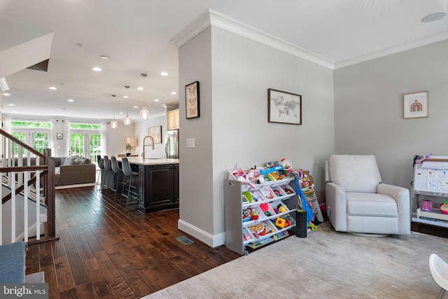 138 Merrimack Way, Arnold, MD 21012 - rec room with ornamental molding, recessed lighting, dark wood-type flooring, a sink, and baseboards