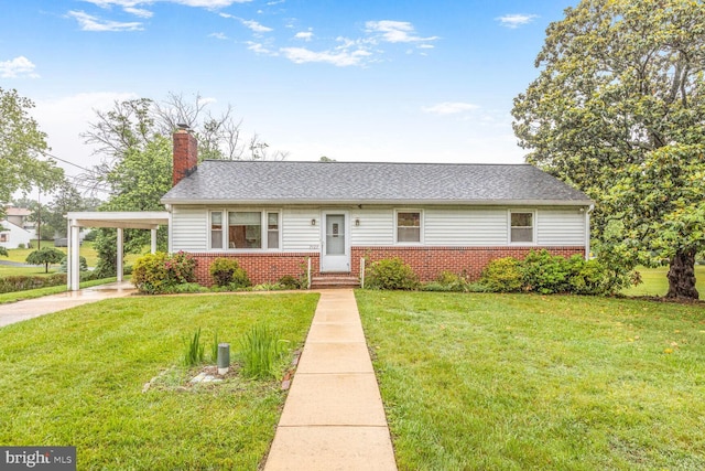 7423 Phelps Rd, Hanover, MD 21076 - view of front facade with brick siding, a front yard, a chimney, and a shingled roof