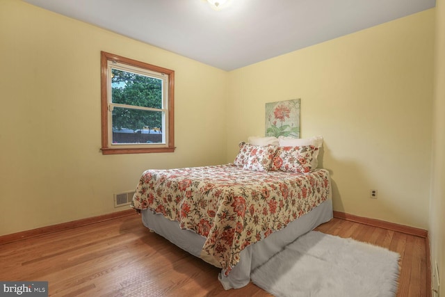 7423 Phelps Rd, Hanover, MD 21076 - bedroom with baseboards and wood finished floors
