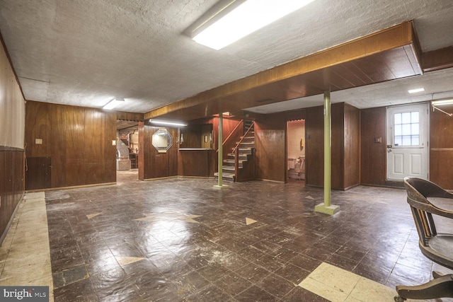 7423 Phelps Rd, Hanover, MD 21076 - basement with wood walls, tile patterned floors, and stairs