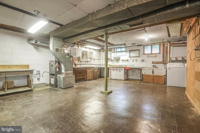 7423 Phelps Rd, Hanover, MD 21076 - basement with washer / dryer, tile patterned floors, concrete block wall, and a workshop area