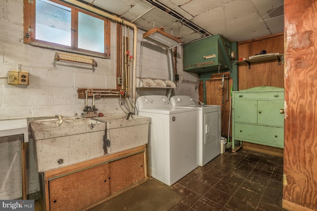 7423 Phelps Rd, Hanover, MD 21076 - laundry area featuring washing machine and clothes dryer, concrete block wall, and dark flooring