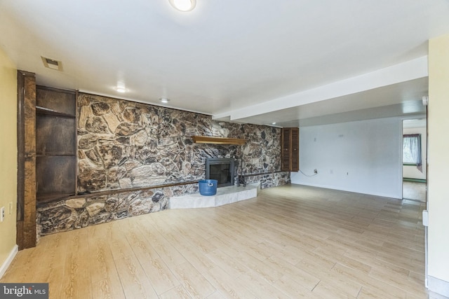 809 W 3rd Ave, Runnemede, NJ 08078 - unfurnished living room with a fireplace, wood finished floors, and baseboards