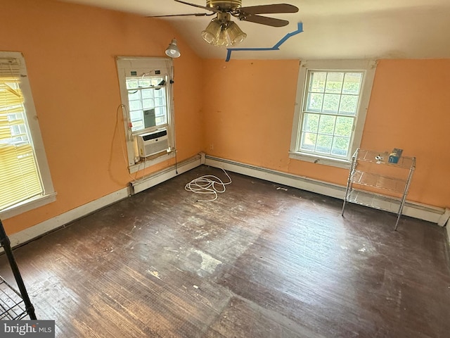 unfurnished room with a ceiling fan, lofted ceiling, baseboards, cooling unit, and wood finished floors
