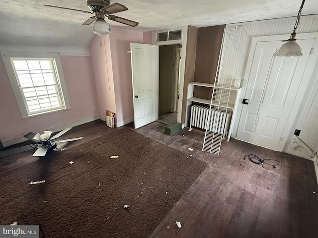 unfurnished bedroom with baseboards and wood finished floors