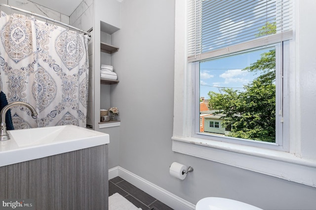 442 Poplar St, Lancaster, PA 17603 - full bathroom with tile patterned flooring, toilet, vanity, baseboards, and a shower with curtain