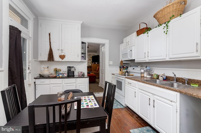 442 Poplar St, Lancaster, PA 17603 - kitchen with white appliances, a sink, dark wood-style flooring, and white cabinetry