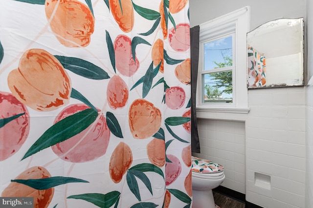 442 Poplar St, Lancaster, PA 17603 - full bathroom with toilet, tile walls, a shower with curtain, and wood finished floors