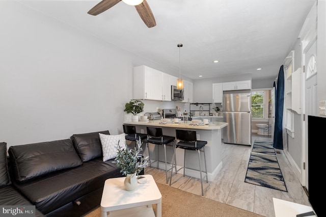 442 Poplar St, Lancaster, PA 17603 - living area featuring ceiling fan, light marble finish flooring, and recessed lighting