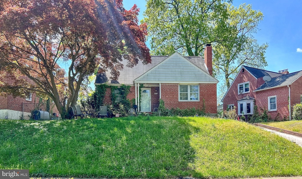 view of front of home featuring a chimney