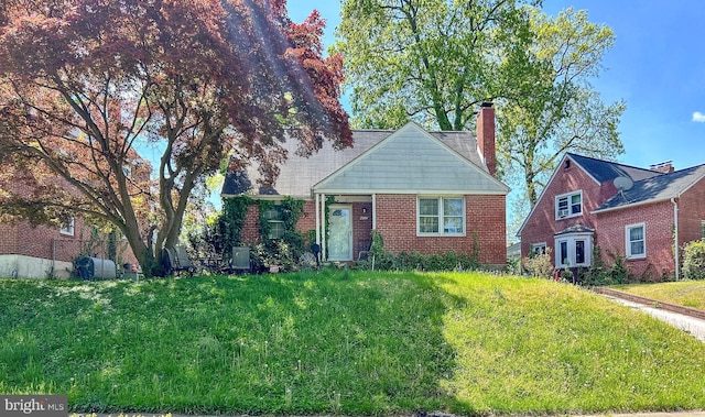 view of front of home featuring a chimney