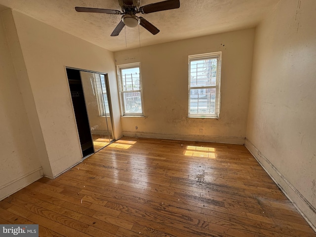 5841 Race St, Philadelphia, PA 19139 - unfurnished bedroom featuring a closet, a textured ceiling, and wood-type flooring