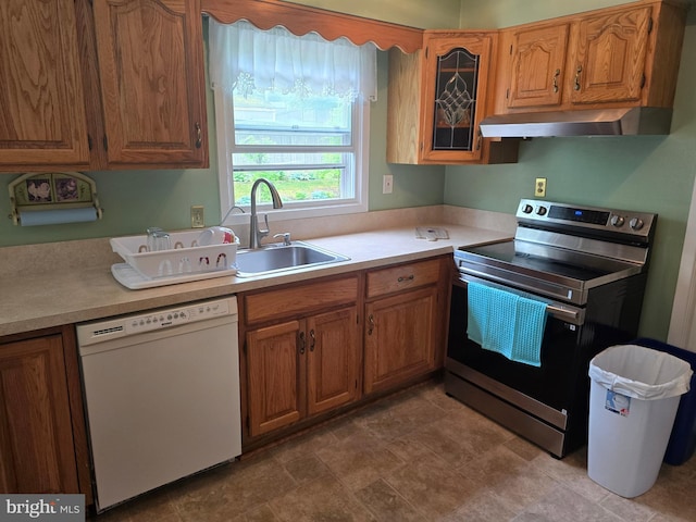 kitchen with light countertops, a sink, stainless steel electric range, extractor fan, and dishwasher