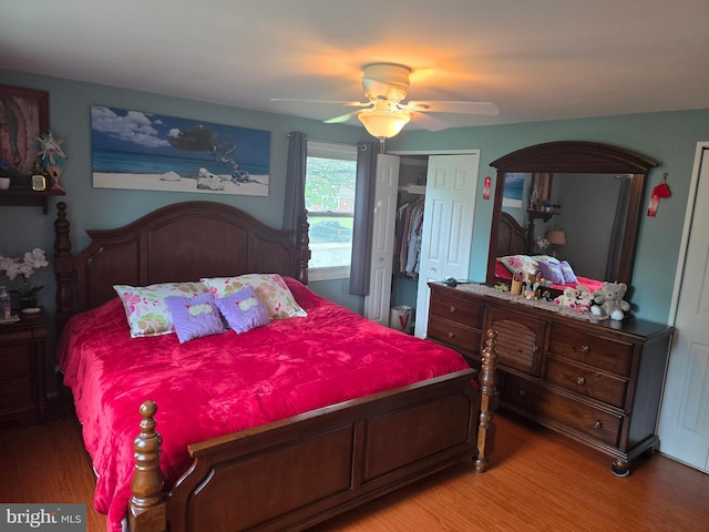 bedroom with ceiling fan, a closet, and light wood-type flooring