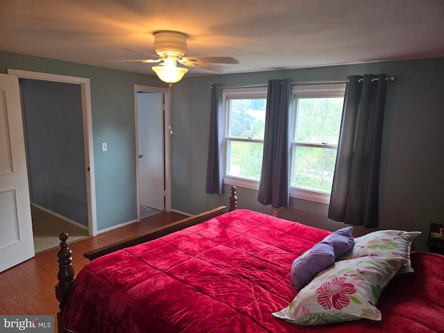bedroom featuring a ceiling fan and wood finished floors
