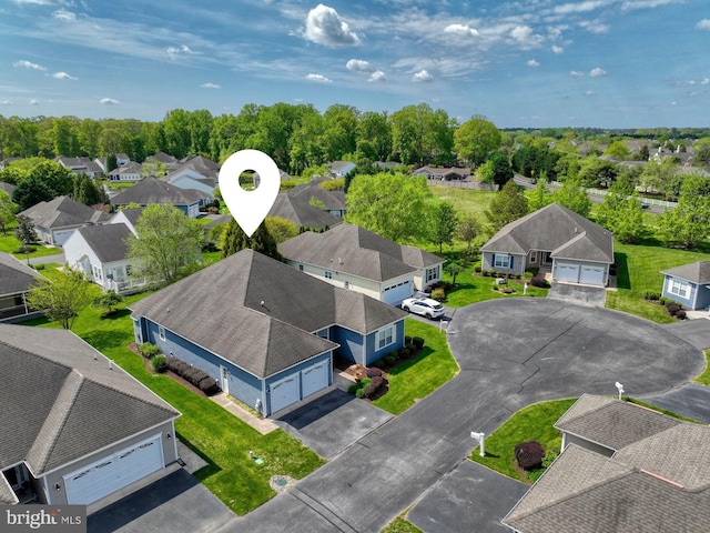 birds eye view of property with a residential view
