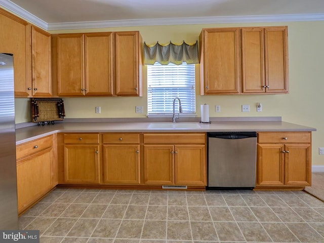 kitchen with crown molding, appliances with stainless steel finishes, light countertops, and a sink
