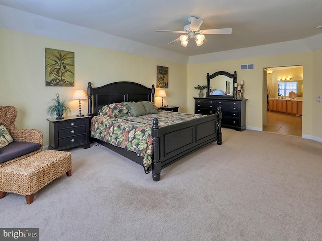 carpeted bedroom featuring visible vents, baseboards, and ceiling fan