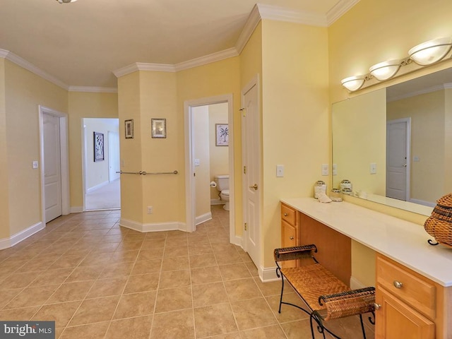 bathroom featuring ornamental molding, toilet, and tile patterned floors