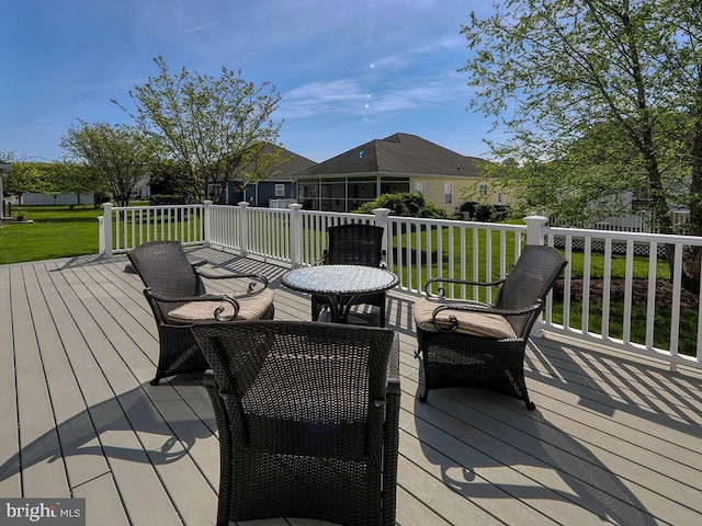 deck with a yard and a residential view