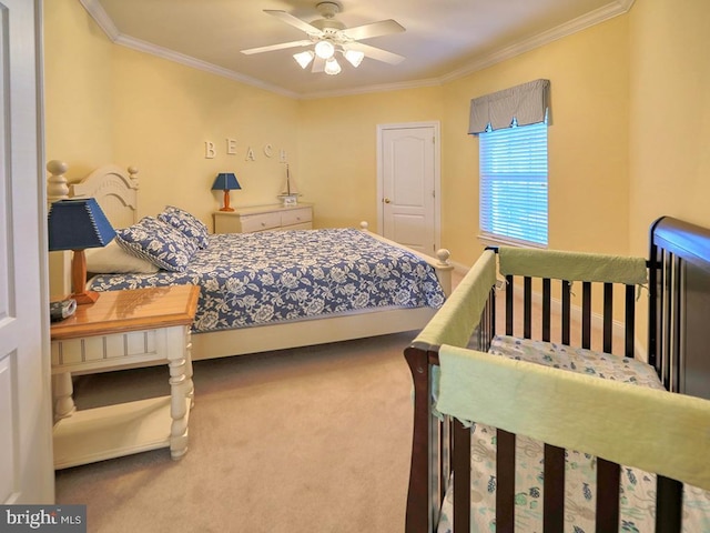 bedroom with crown molding, carpet, and a ceiling fan