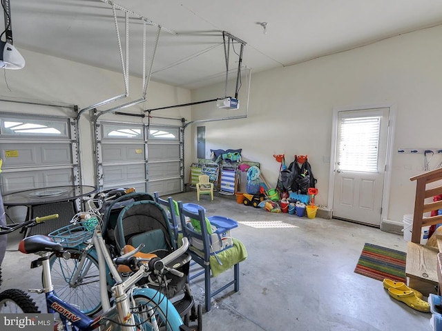 garage with electric panel and a garage door opener