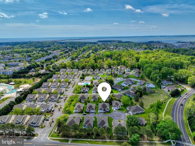 bird's eye view with a water view and a residential view