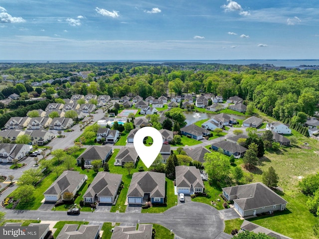 birds eye view of property with a residential view