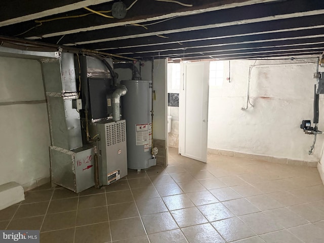 2302 E Albert St, Philadelphia, PA 19125 - below grade area featuring tile patterned floors, heating unit, and gas water heater
