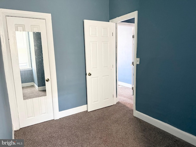 2302 E Albert St, Philadelphia, PA 19125 - unfurnished bedroom featuring dark colored carpet and baseboards