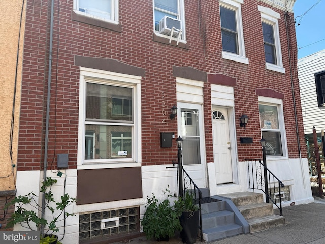 2302 E Albert St, Philadelphia, PA 19125 - view of property featuring entry steps, cooling unit, and brick siding