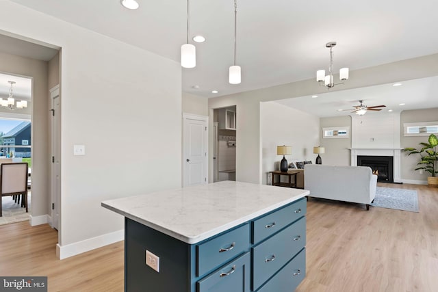 1010 Edorma Ct, Harrisburg, PA 17112 - kitchen with light wood-type flooring, plenty of natural light, baseboards, and ceiling fan with notable chandelier