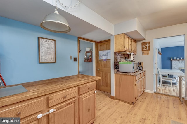 33 Miracle Dr, Williamstown, NJ 08094 - kitchen featuring light wood-type flooring, decorative light fixtures, and baseboards