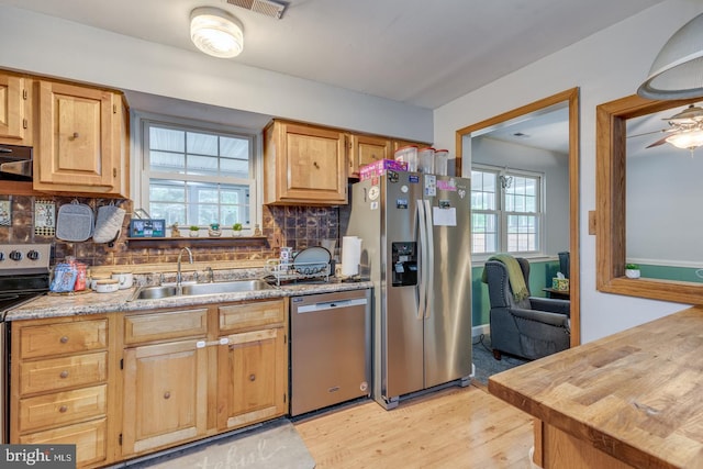 33 Miracle Dr, Williamstown, NJ 08094 - kitchen featuring stainless steel appliances, a sink, light wood finished floors, decorative backsplash, and light brown cabinets