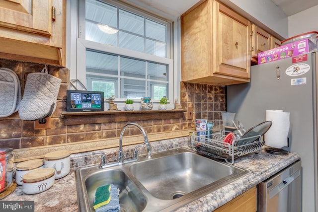33 Miracle Dr, Williamstown, NJ 08094 - kitchen featuring a sink, stainless steel dishwasher, decorative backsplash, freestanding refrigerator, and light countertops