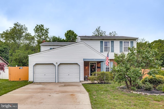 33 Miracle Dr, Williamstown, NJ 08094 - traditional-style home with an attached garage, brick siding, driveway, and a front yard