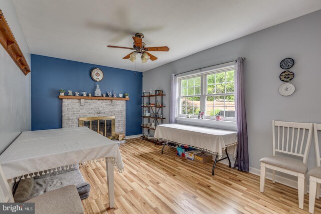 33 Miracle Dr, Williamstown, NJ 08094 - dining room with ceiling fan, wood finished floors, a brick fireplace, and baseboards