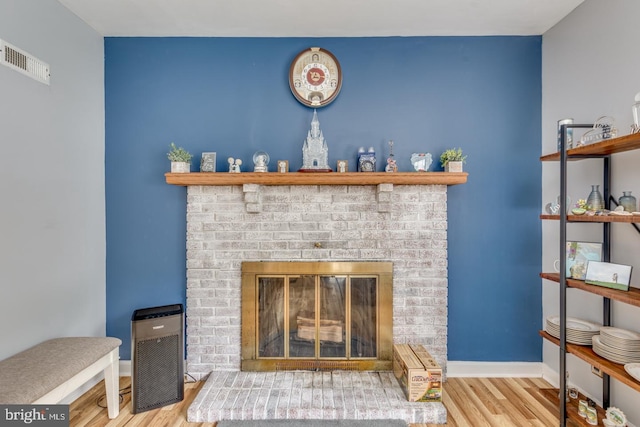 33 Miracle Dr, Williamstown, NJ 08094 - detailed view of wood finished floors, a brick fireplace, and baseboards