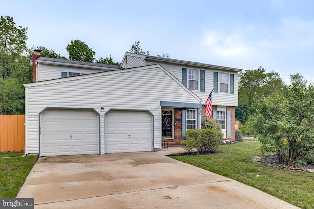 33 Miracle Dr, Williamstown, NJ 08094 - view of front of property with driveway, a garage, brick siding, and a chimney