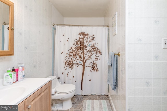 33 Miracle Dr, Williamstown, NJ 08094 - full bathroom with tile walls, vanity, toilet, a shower with shower curtain, and tile patterned flooring