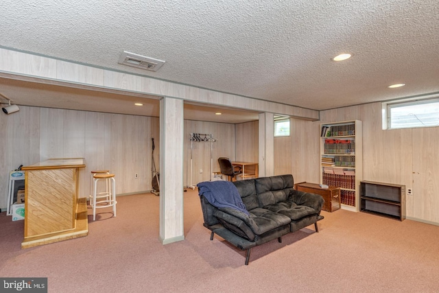 33 Miracle Dr, Williamstown, NJ 08094 - living area featuring carpet floors, a textured ceiling, wood walls, and recessed lighting