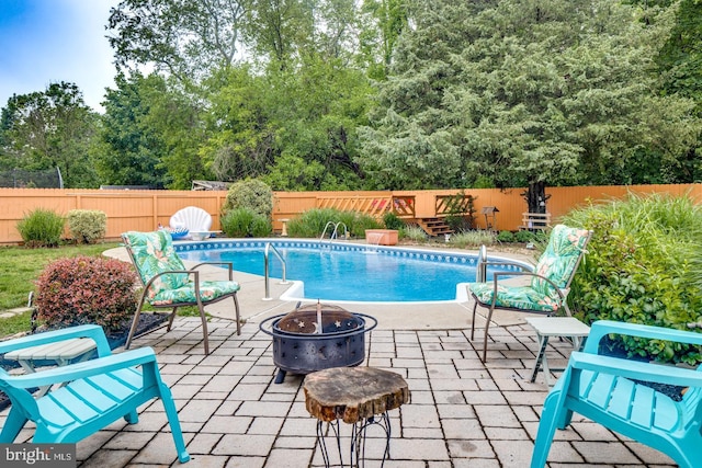 33 Miracle Dr, Williamstown, NJ 08094 - view of pool with a fire pit, a fenced backyard, and a patio area