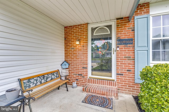 33 Miracle Dr, Williamstown, NJ 08094 - doorway to property with brick siding and a porch