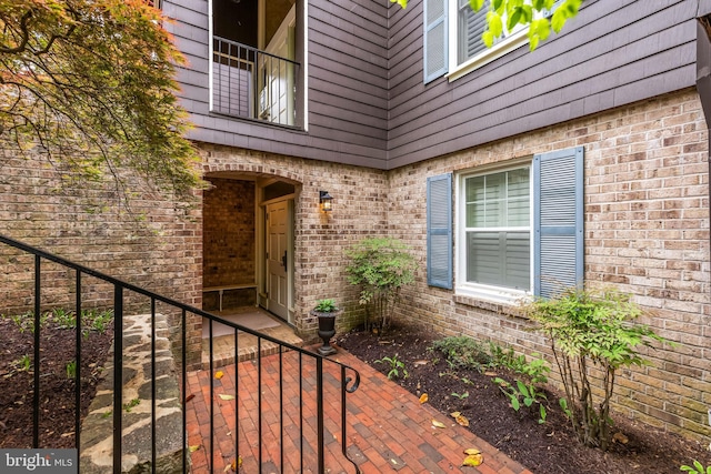 property entrance with brick siding