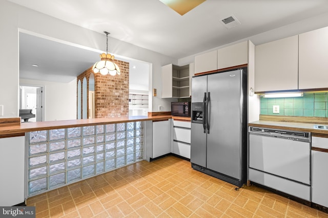kitchen with open shelves, butcher block countertops, stainless steel refrigerator with ice dispenser, and dishwasher
