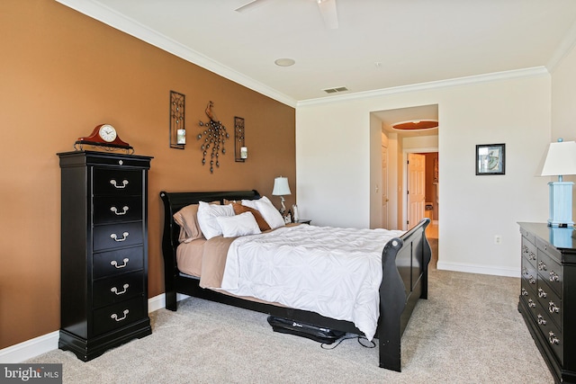 bedroom with a ceiling fan, crown molding, visible vents, baseboards, and light carpet