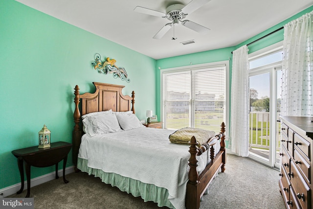 bedroom featuring carpet flooring, multiple windows, visible vents, and access to outside