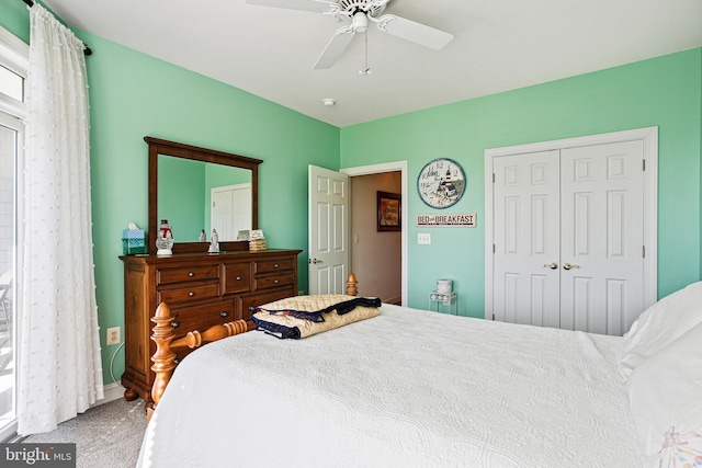 bedroom with carpet, a closet, baseboards, and ceiling fan