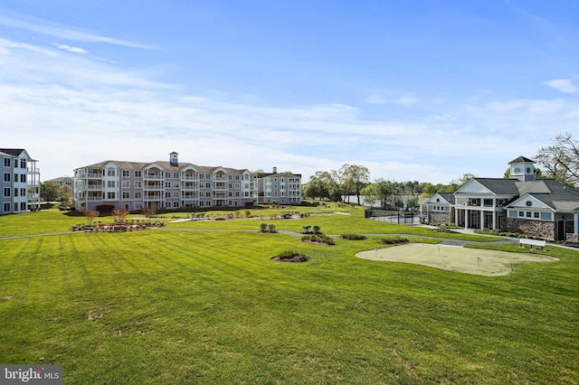view of home's community featuring a yard